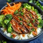 Korean BBQ Steak Rice Bowls are a delightful fusion of flavors and textures that have become increasingly popular in home kitchens and restaurants alike. This dish combines tender, marinated flank steak with vibrant vegetables and a rich, spicy cream sauce, creating a meal that is not only visually appealing but also packed with nutrients. The contrast of savory beef, aromatic jasmine rice, and fresh vegetables makes for a satisfying and wholesome dish that can be enjoyed for lunch or dinner.